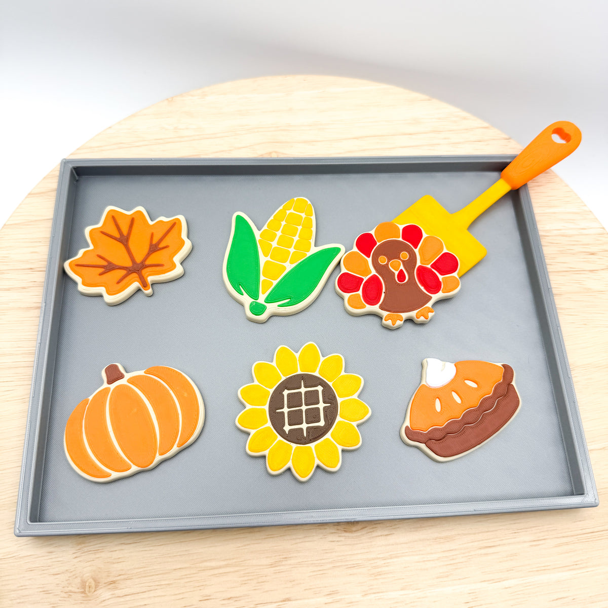 Top view of the Thanksgiving cookie tray set with leaf, corn, turkey, pumpkin, sunflower and pie cookies