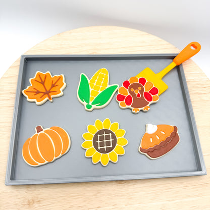 Top view of the Thanksgiving cookie tray set with leaf, corn, turkey, pumpkin, sunflower and pie cookies