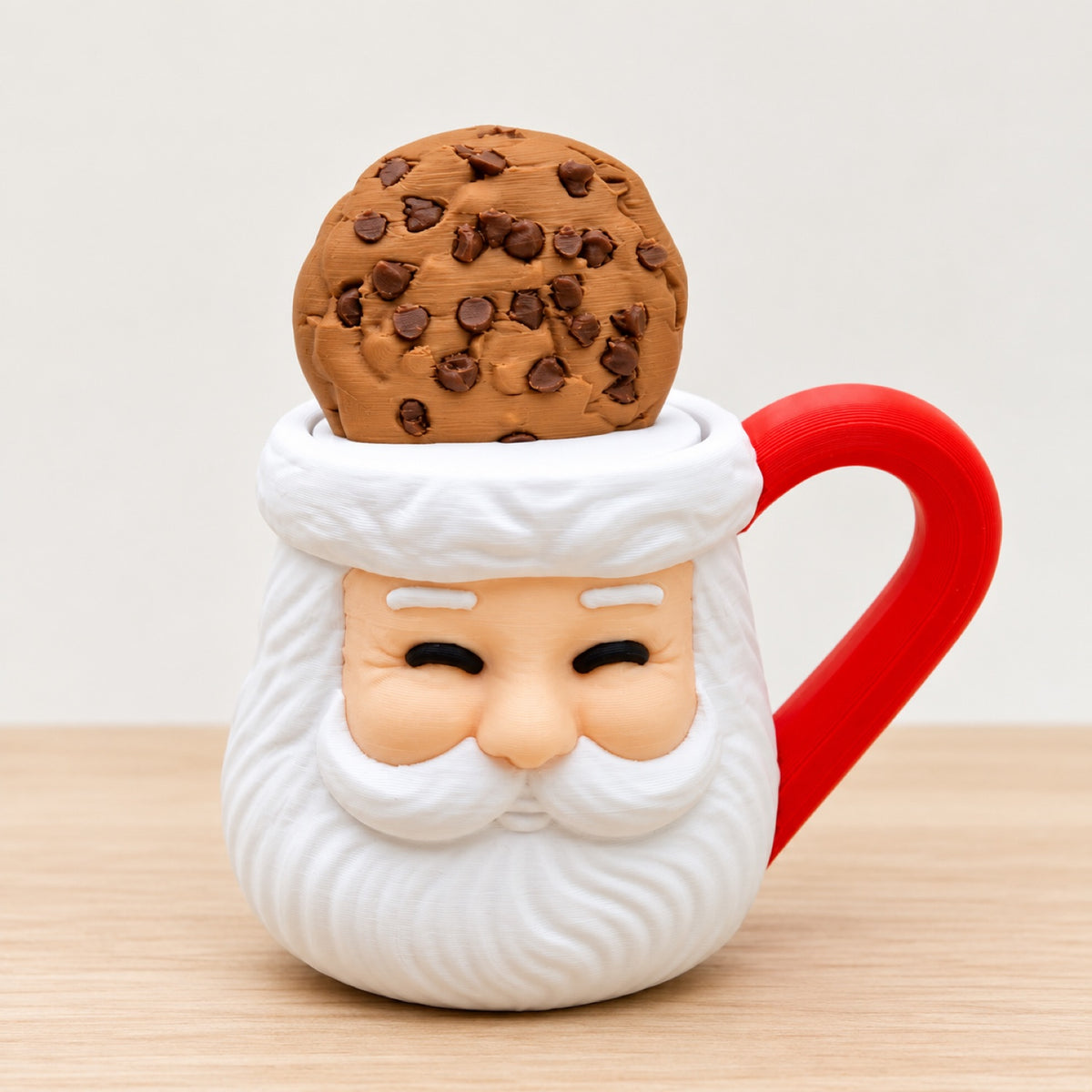 Santa Cookie Mug clicker: red Santa mug topped with a chocolate chip cookie clicker