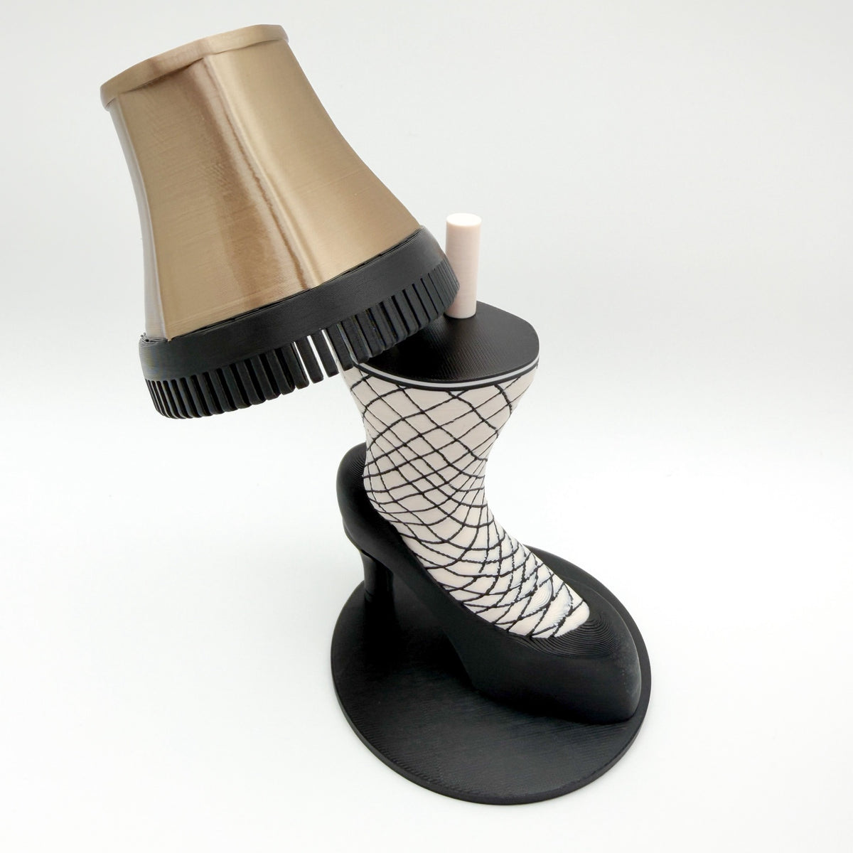 Leg Lamp Accessories set: removable gold shade with black trim, fishnet stocking leg and black high heel on a round black base